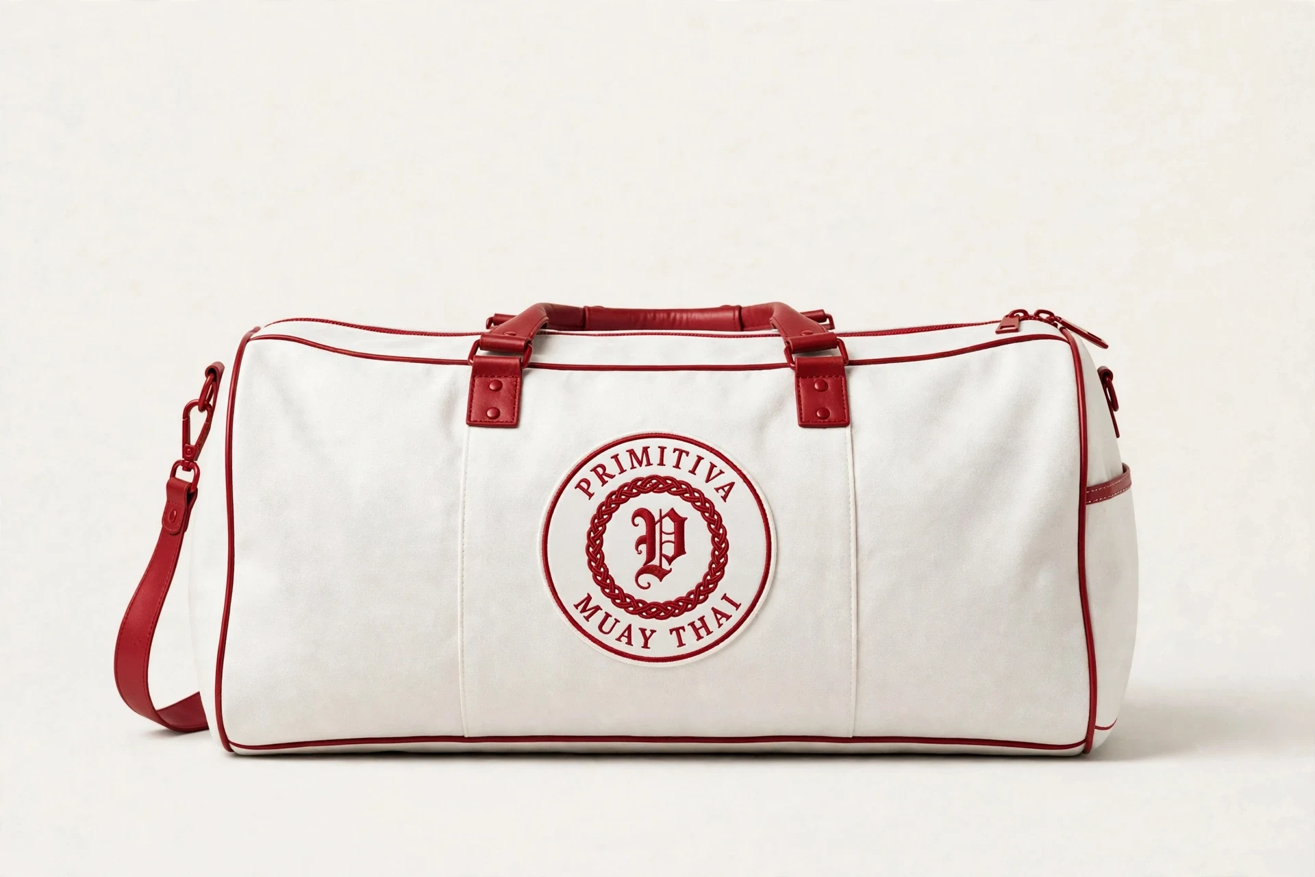 Primitiva gym duffel bag in white and red with the emblem on the side panel
