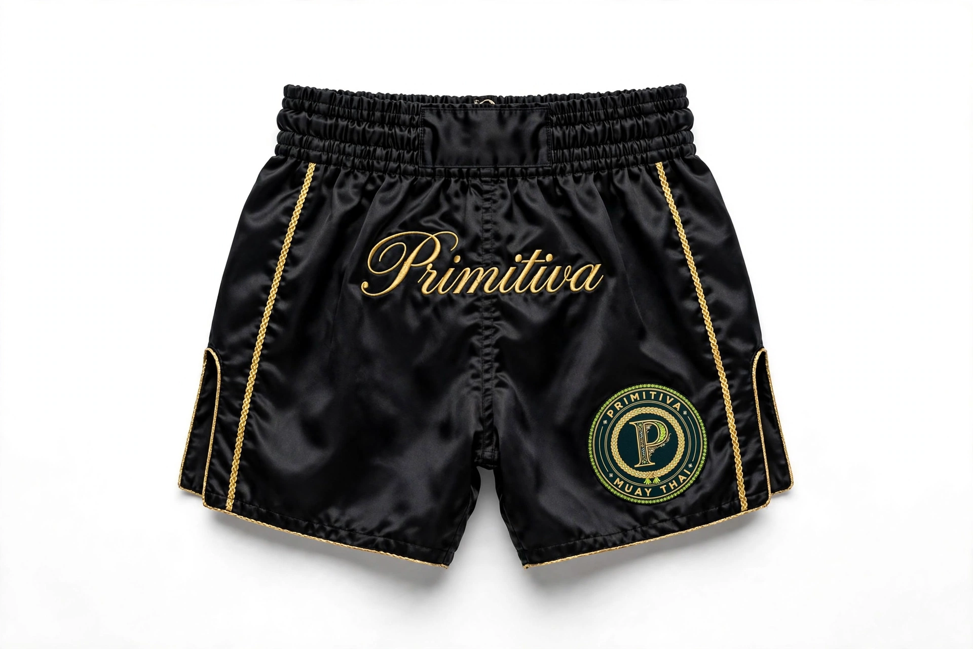 Primitiva fight shorts in black with gold script wordmark and emblem