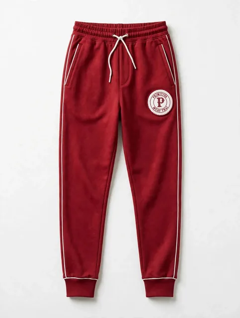 Primitiva pantalon jogger WR en rouge et blanc avec chevilles à revers et l’emblème sur la cuisse